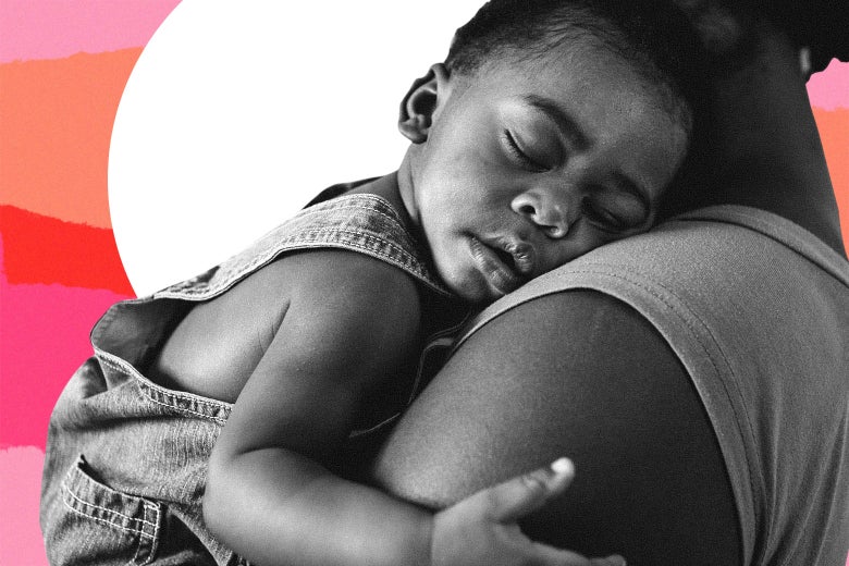 Mom holding a sleeping baby.